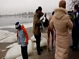 straight Russian guys dive into the icy water