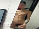 Thai twink porn pleasing himself in front of the mirror